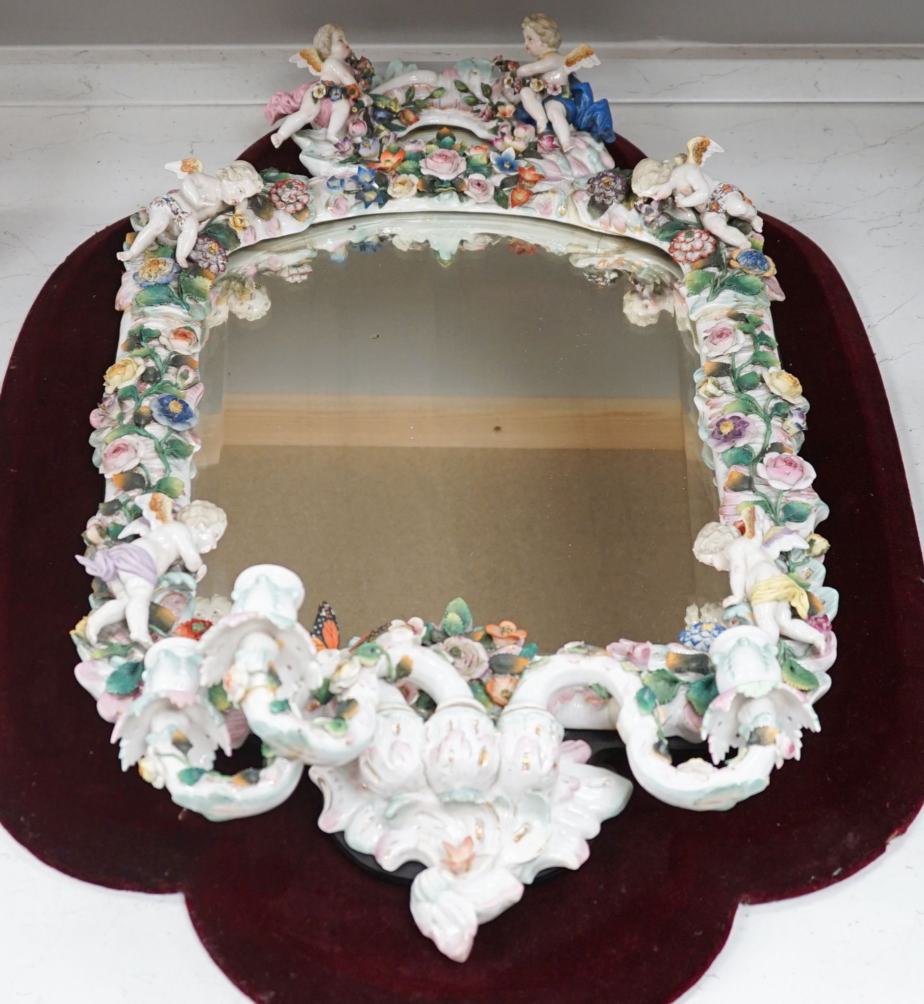 A large Sitzendorf girandole mirror 83cm excl velvet mount